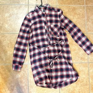Flannel top with tie at waist.